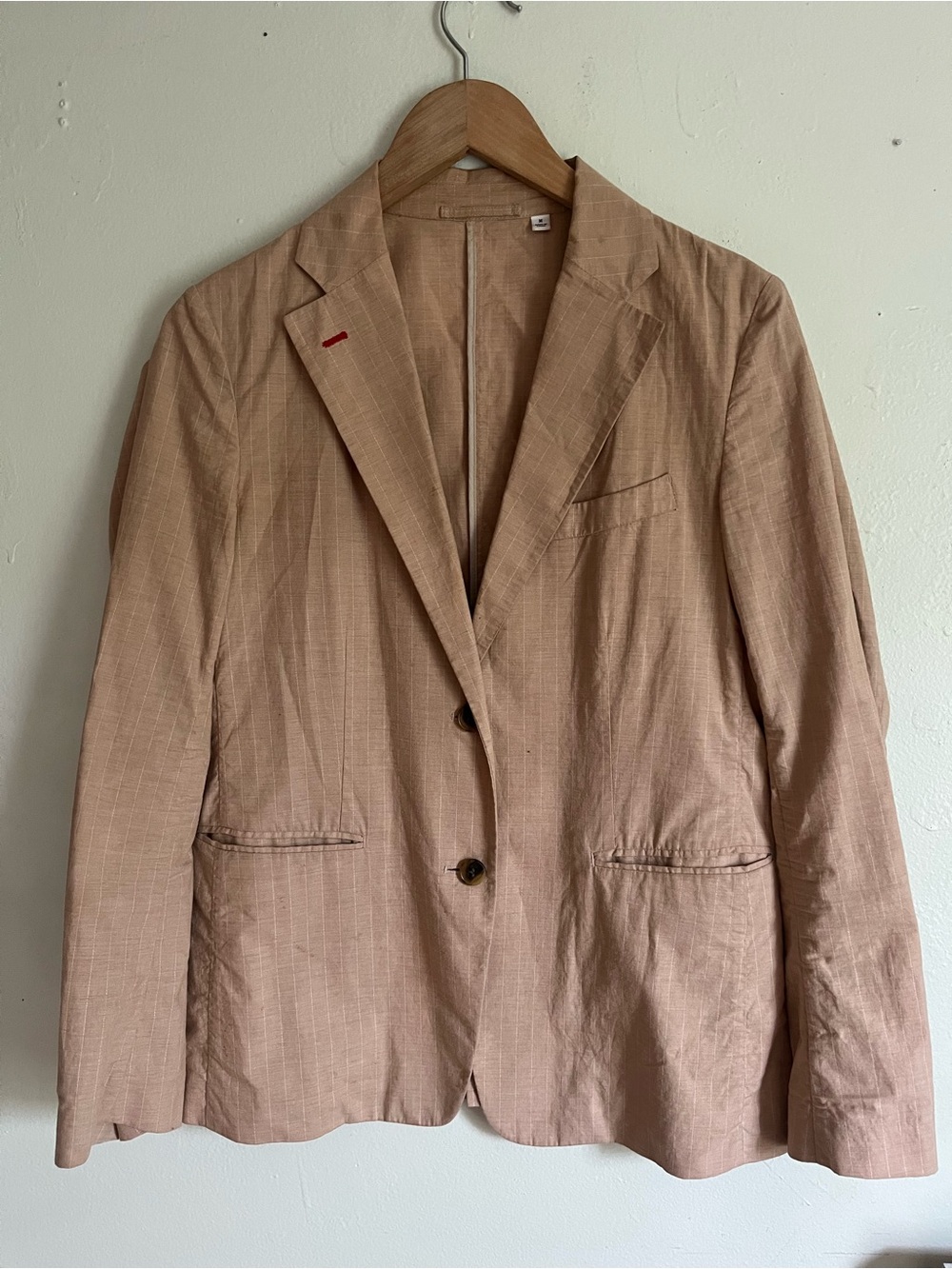 Woman’s tan blazer by uniqlo